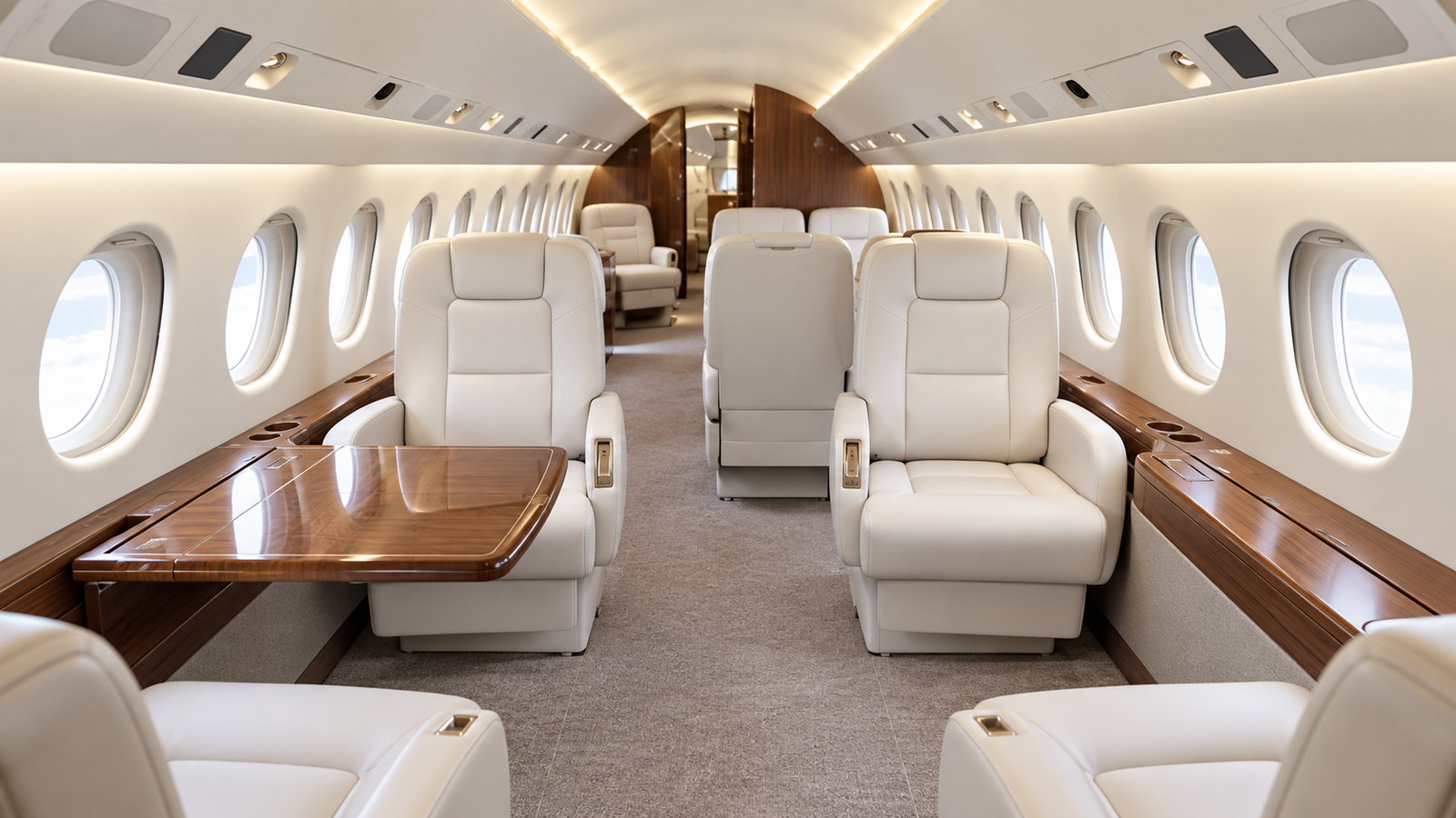 Falcon 900EX cabin looking forward, club seats and a table in a wide cabin