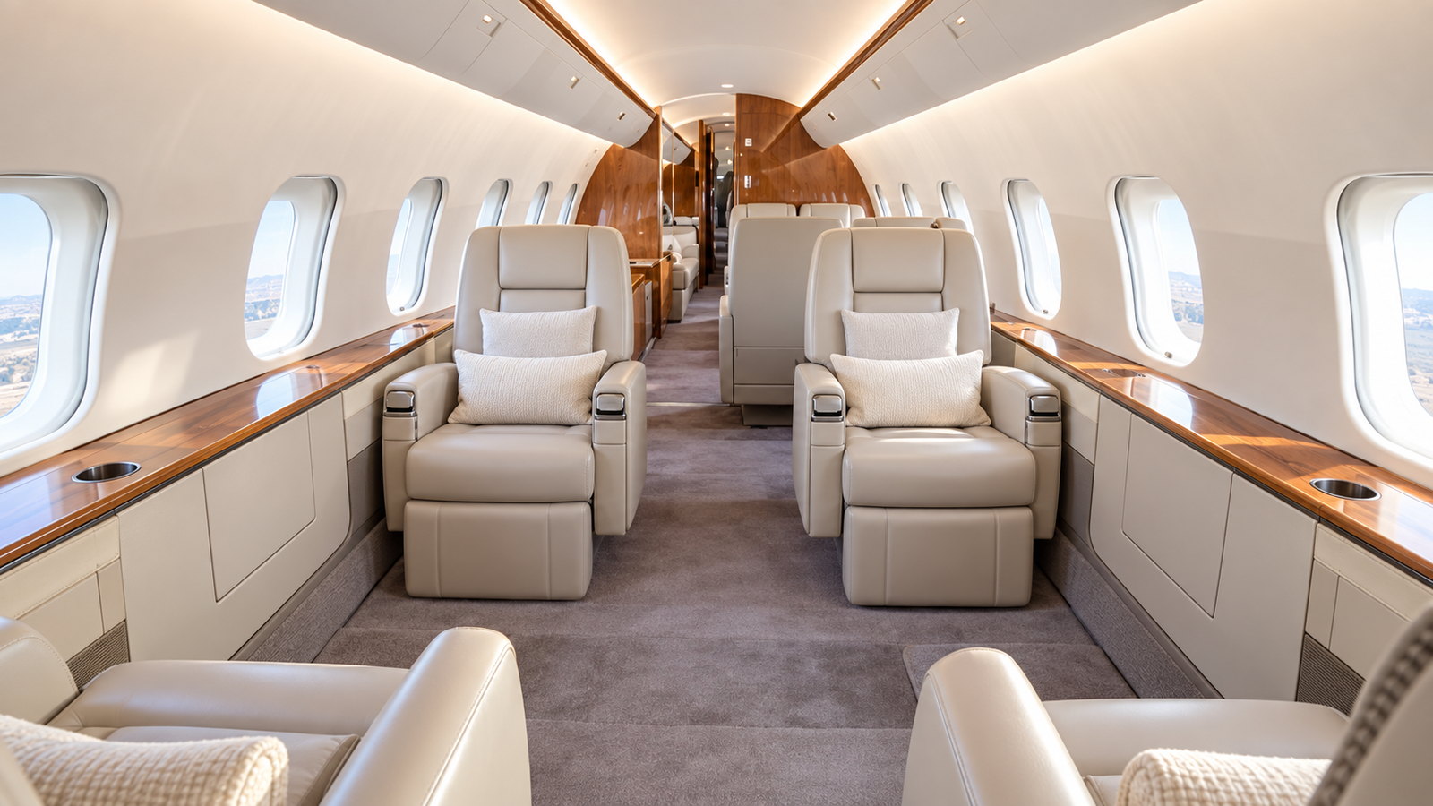 Global 5000 cabin looking aft, club seats and a divan in cream leather
