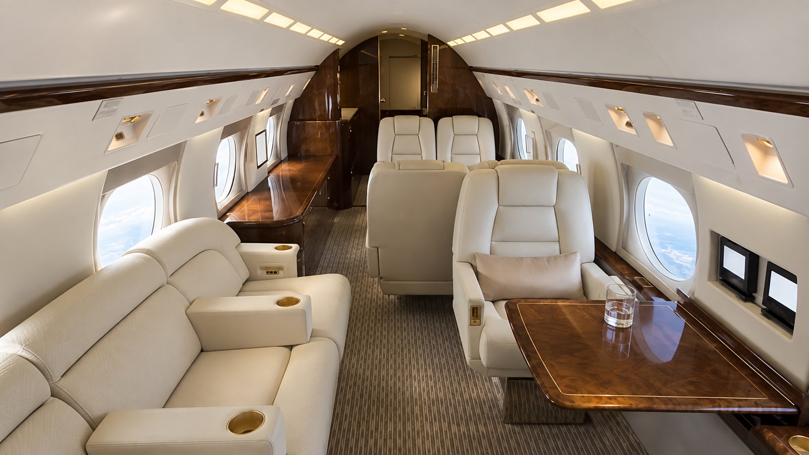 Gulfstream GIV cabin looking forward, club seats and a divan in cream leather