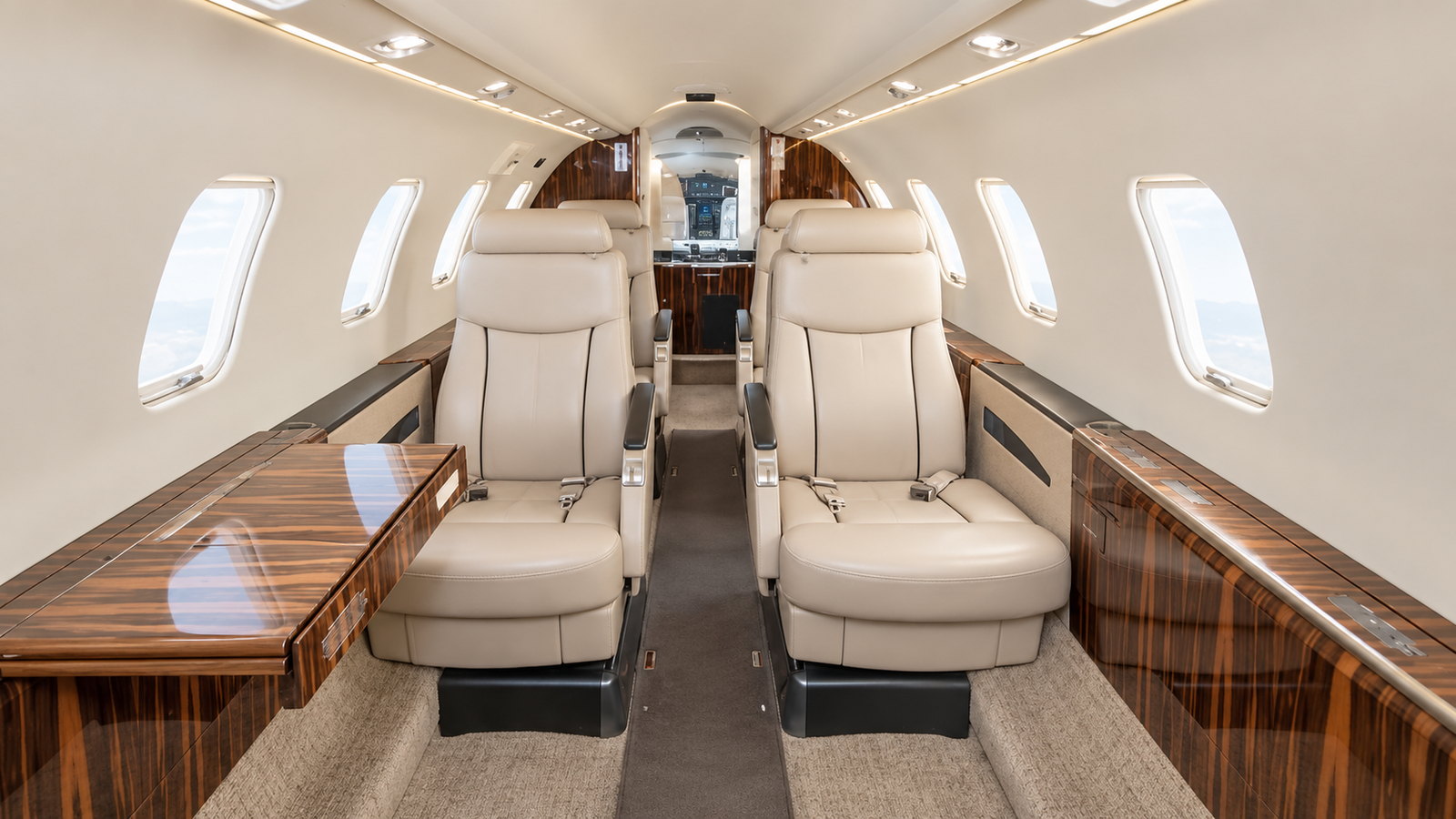 Learjet 40XR cabin looking aft, six seats in cream leather with dark wood