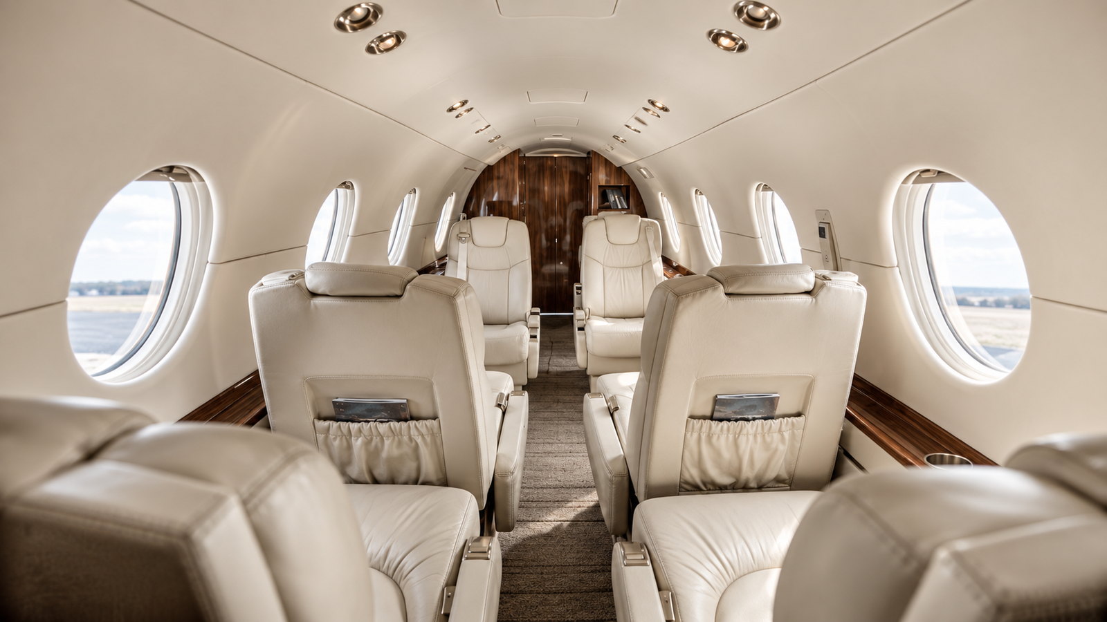 Nextant 400XT cabin looking forward, club seats in light leather