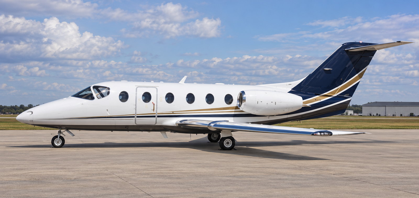 Nextant 400XT light jet on an apron under a clear sky