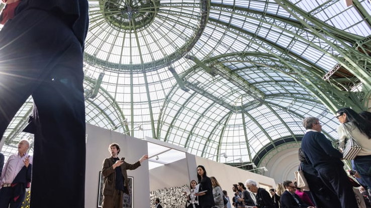 Visitors under the glass dome of the Grand Palais during Art Basel Paris