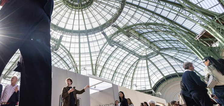 Visitors under the glass dome of the Grand Palais during Art Basel Paris