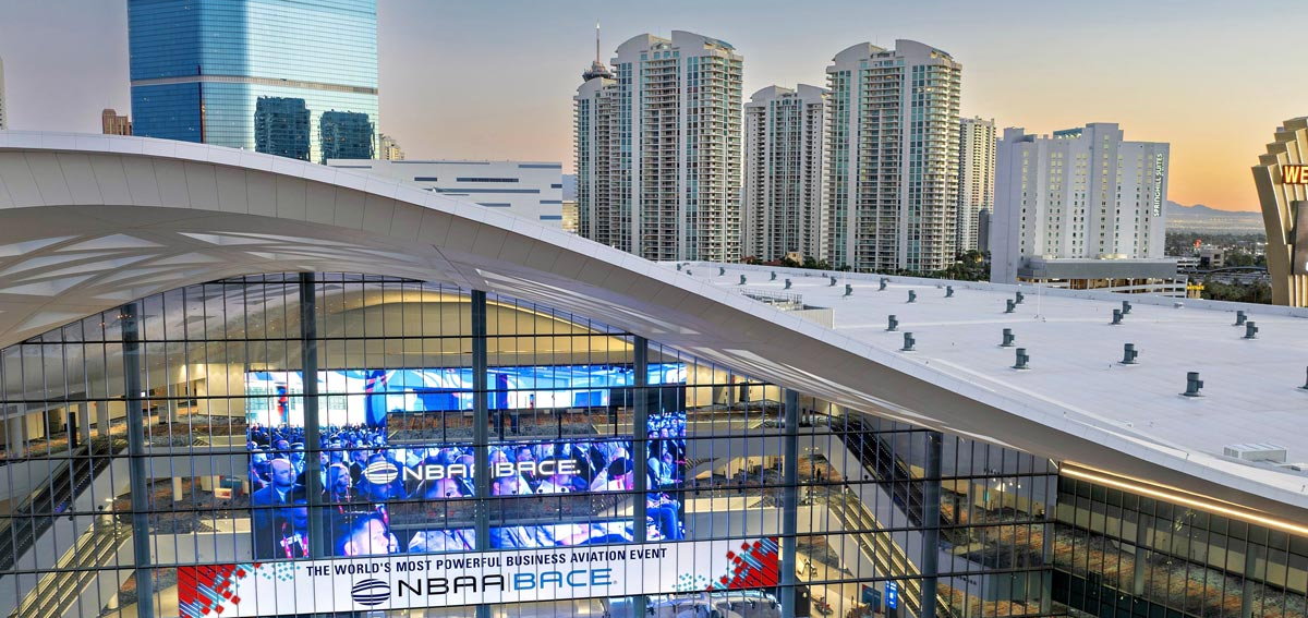 The West Hall of the Las Vegas Convention Center with NBAA-BACE on the screens