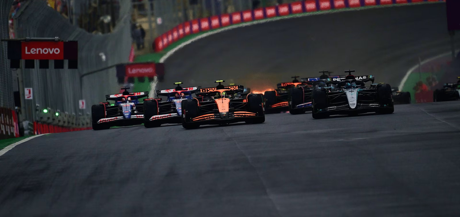 Formula 1 cars climbing the hill at Interlagos in Sao Paulo