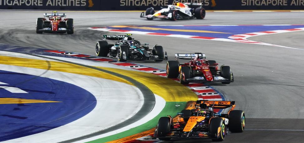 Formula 1 cars on the Marina Bay street circuit in Singapore at night