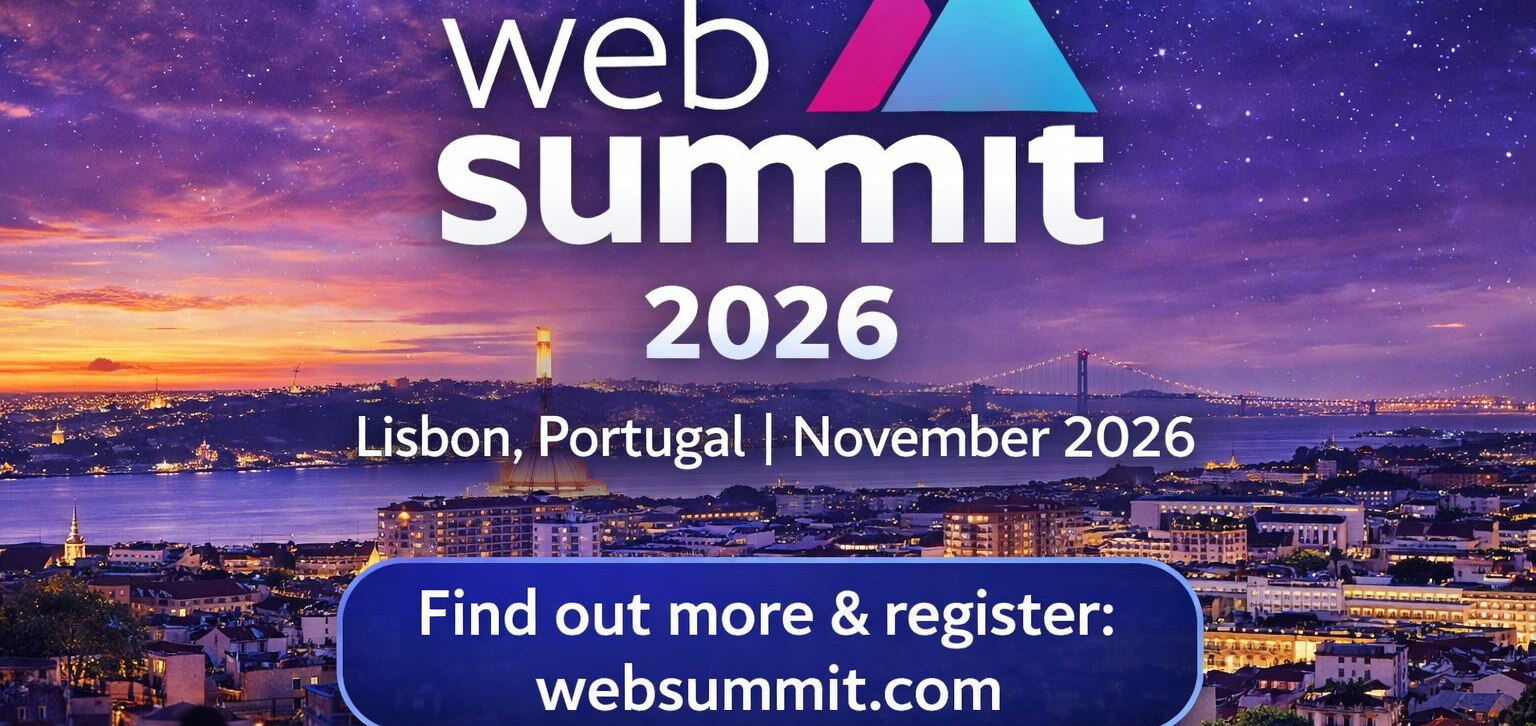Web Summit 2026 banner from the organiser, the Lisbon skyline at dusk behind it