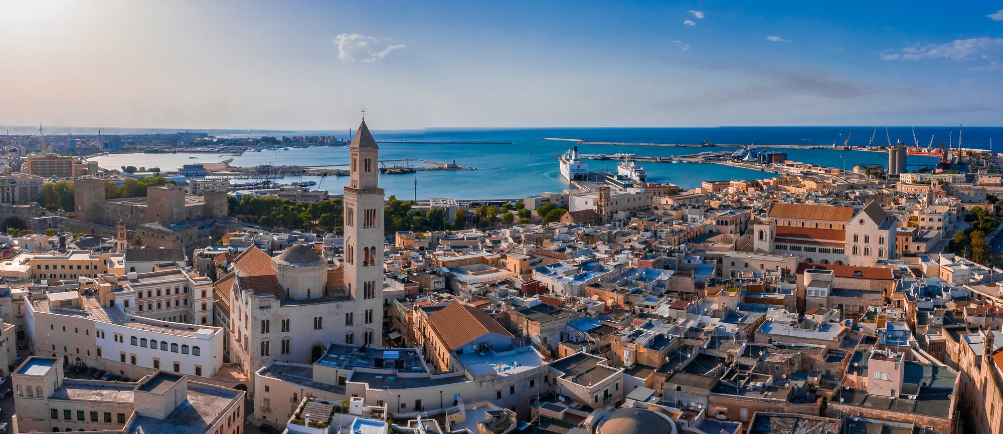 Bari from the air, the cathedral tower over the old town and the port beyond