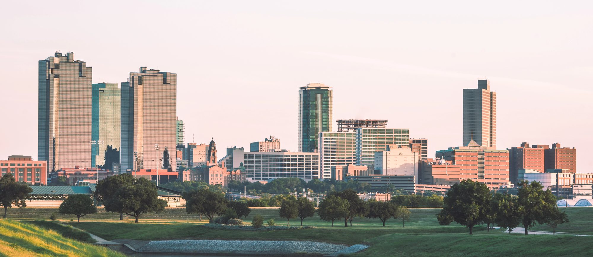 The Fort Worth skyline across the Trinity River at dusk