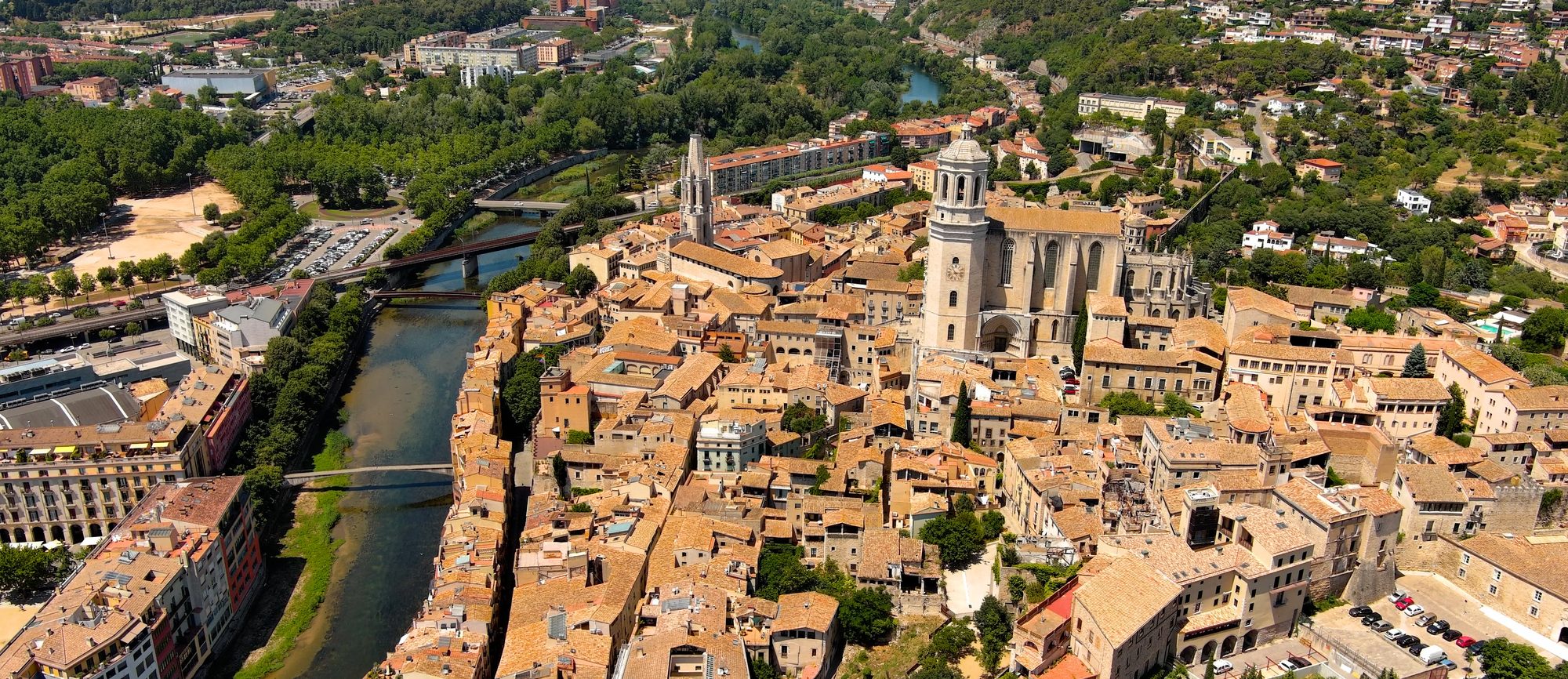 Girona from the air, the cathedral and Sant Feliu above the old town on the Onyar