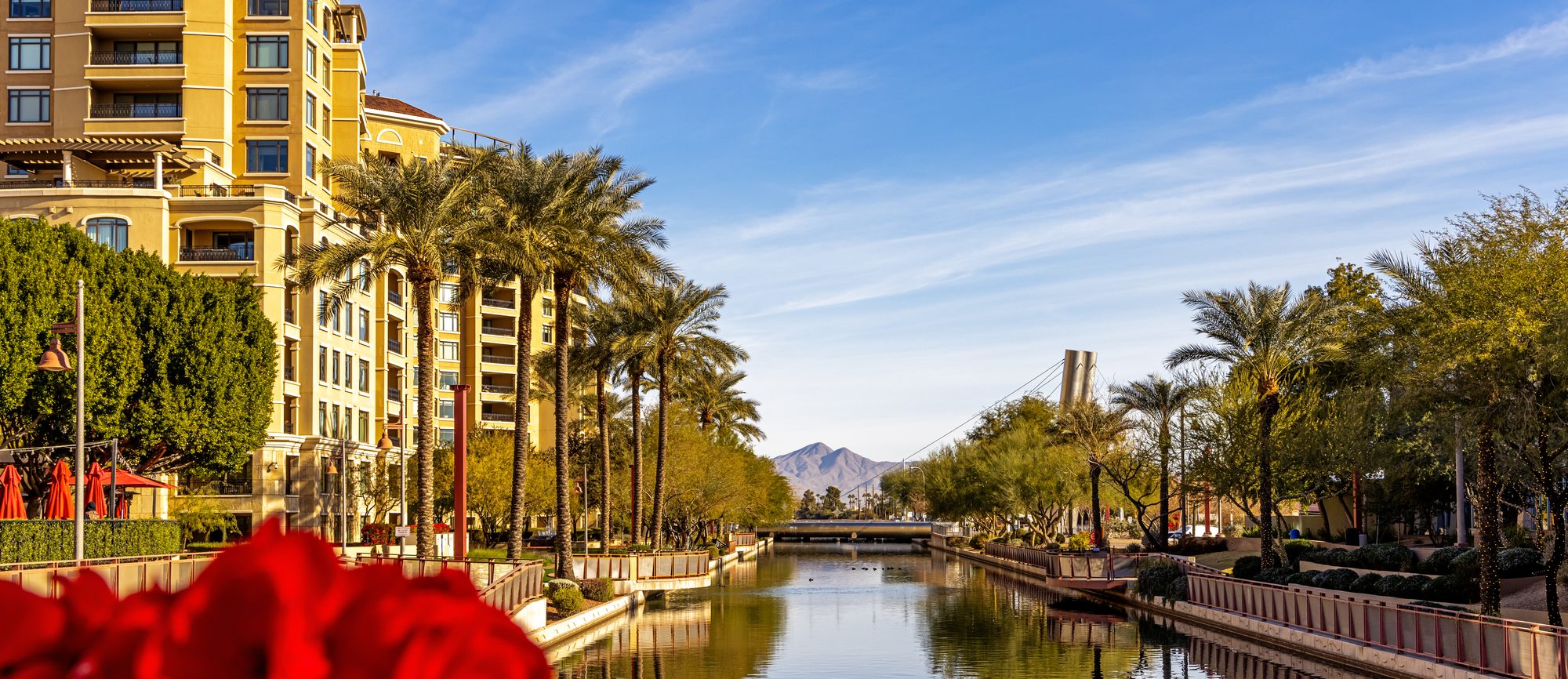 The Scottsdale Waterfront canal with Camelback Mountain in the distance