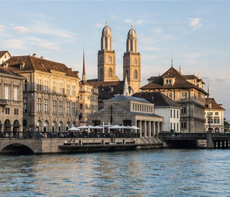 The twin towers of the Grossmunster above the buildings on the bank of the Limmat in Zurich