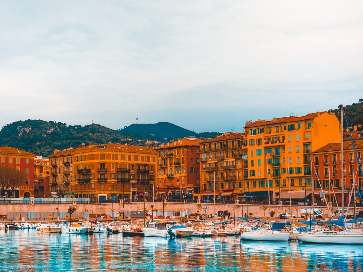 The port at Nice, boats moored under the hill, at the Nice end of the London to Nice empty leg route